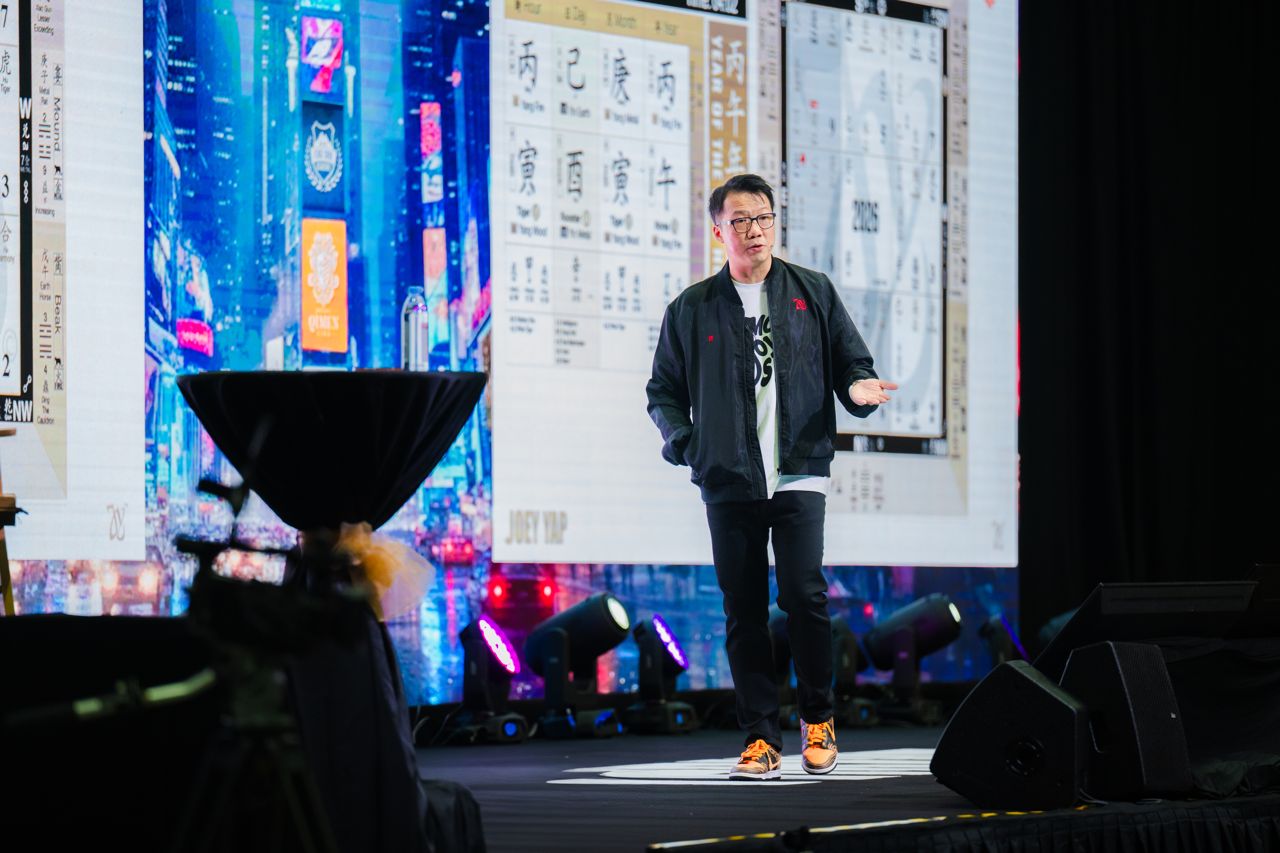 Thrive 2026: Joey mid-talk against the LED wall
